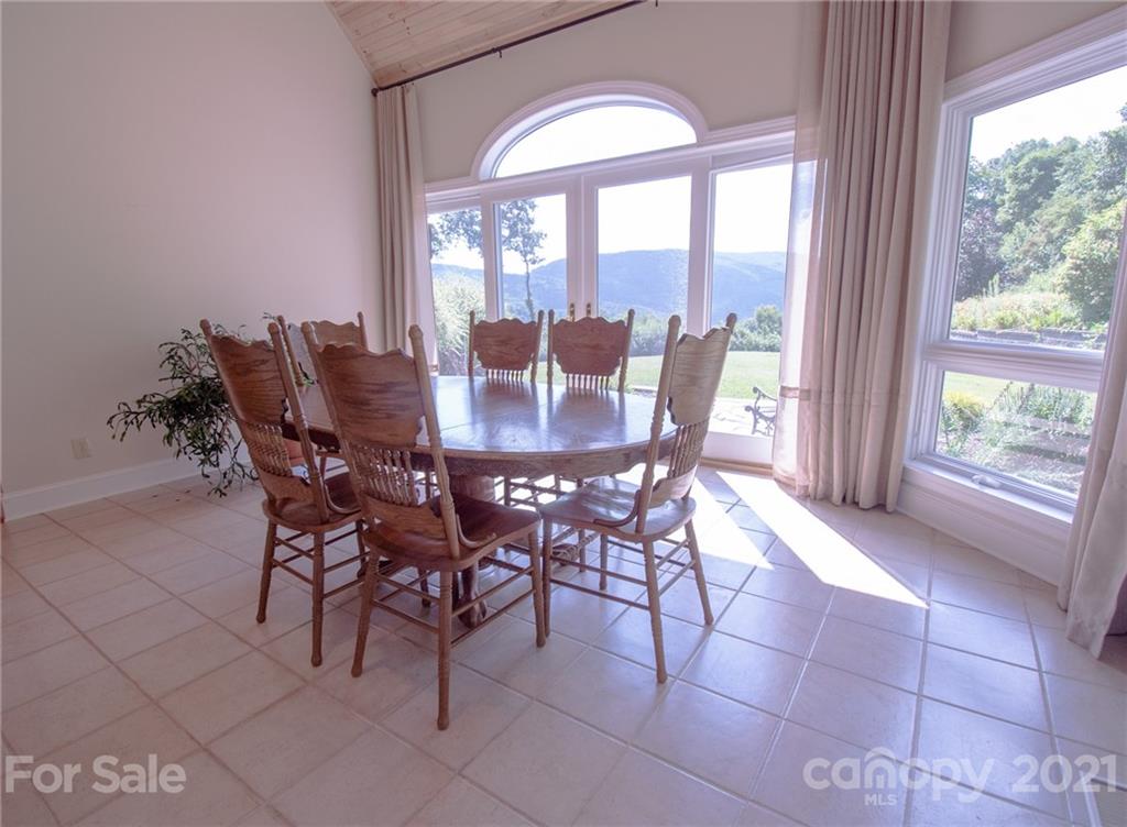 127 Alan Drive Boone, NC 28607 - Photo 22 of 37 a view of a dining room with furniture and window
