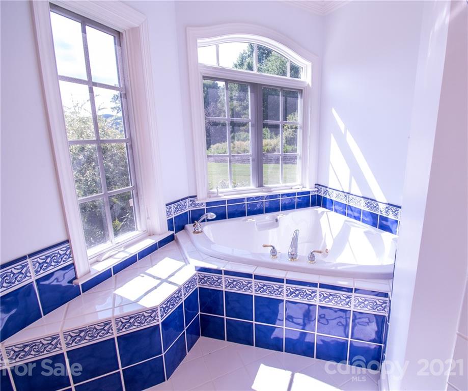 127 Alan Drive Boone, NC 28607 - Photo 24 of 37 a bath tub sitting in front of a window