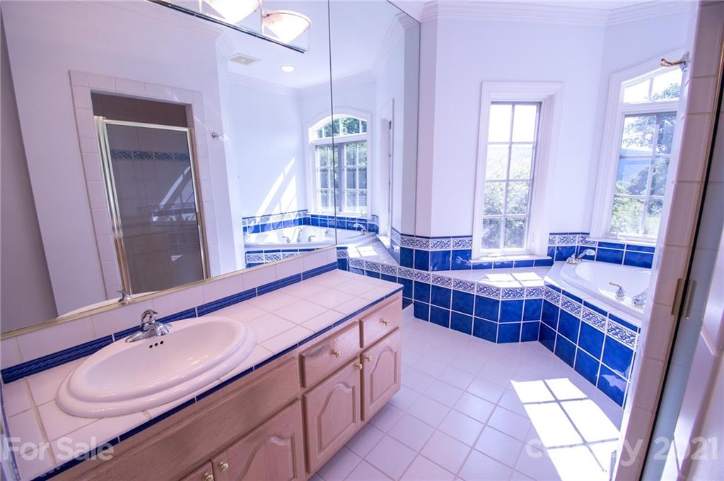 127 Alan Drive Boone, NC 28607 - Photo 25 of 37 a bathroom with a sink and a bathtub