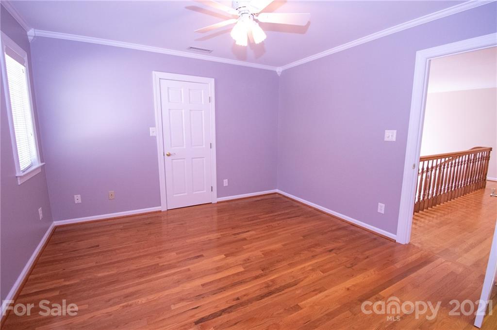 127 Alan Drive Boone, NC 28607 - Photo 26 of 37 a view of empty room with wooden floor and fan