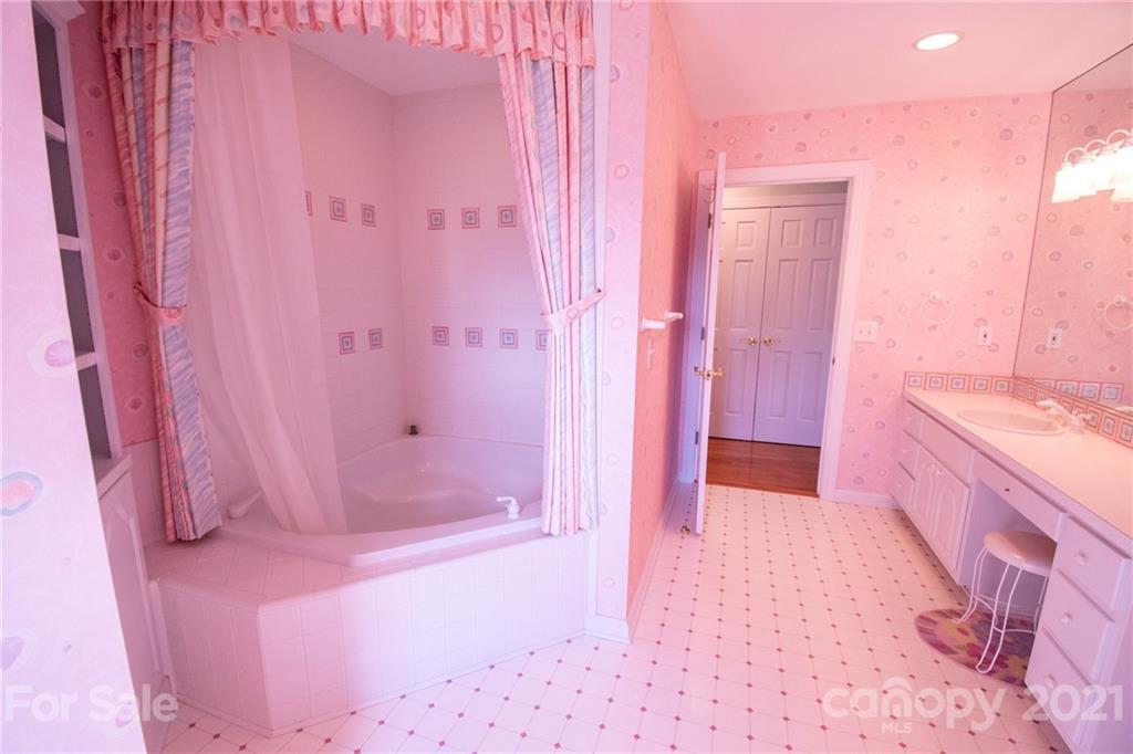 127 Alan Drive Boone, NC 28607 - Photo 30 of 37 a bathroom with a sink vanity tub and shower