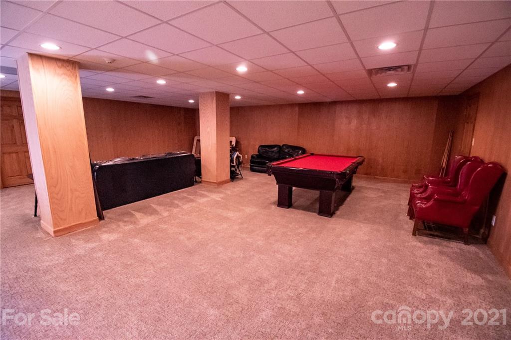 127 Alan Drive Boone, NC 28607 - Photo 36 of 37 an empty room with furniture and a projector screen