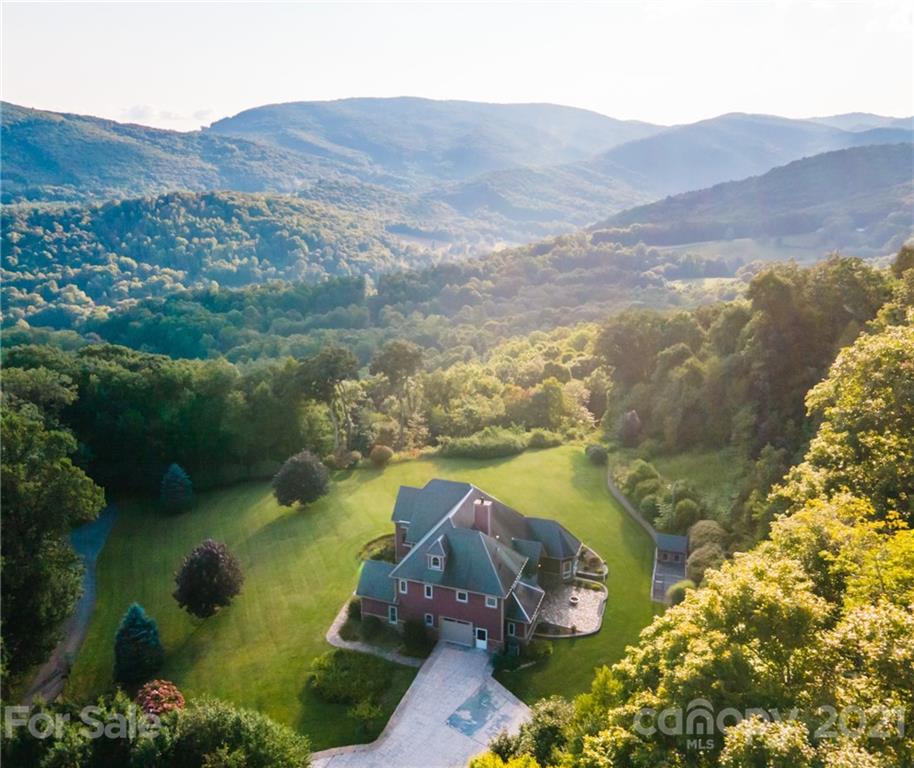 127 Alan Drive Boone, NC 28607 - Photo 7 of 37 a view of a lake with mountains in the background