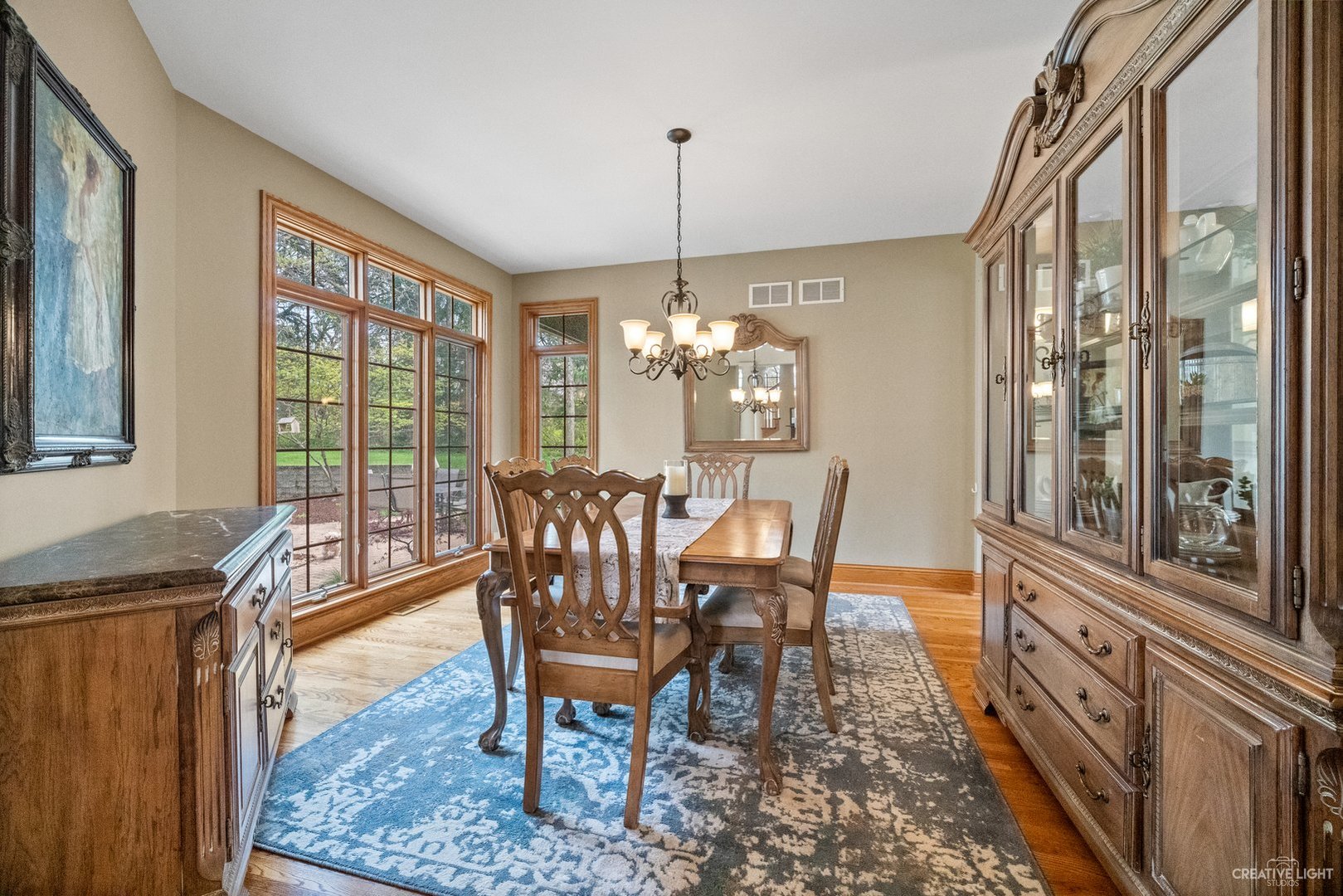 13N227 Coombs Road Elgin, IL 60124 - Photo 22 of 43 a view of a dining room with furniture a chandelier and wooden floor