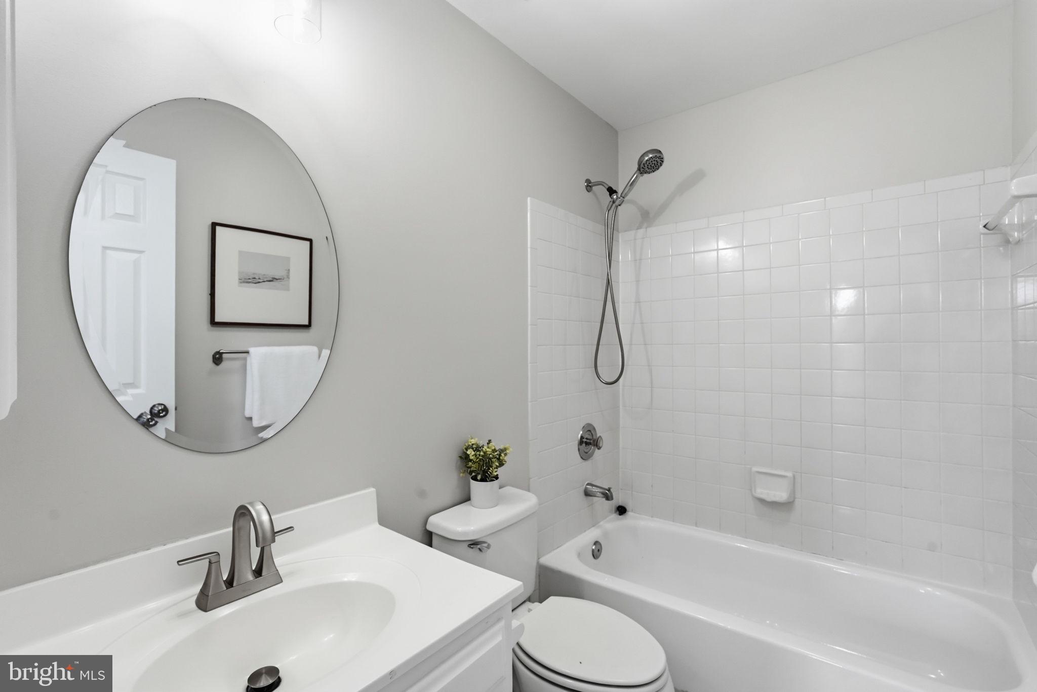 6010 Bingley Road Alexandria, VA 22315 - Photo 23 of 50 a bathroom with a toilet sink and a mirror