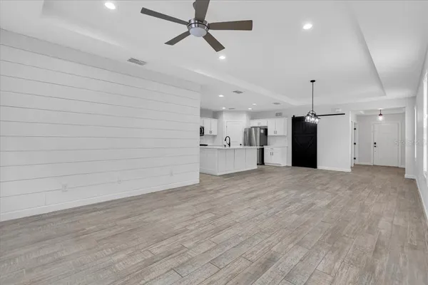 a kitchen with stainless steel appliances a refrigerator stove microwave and sink