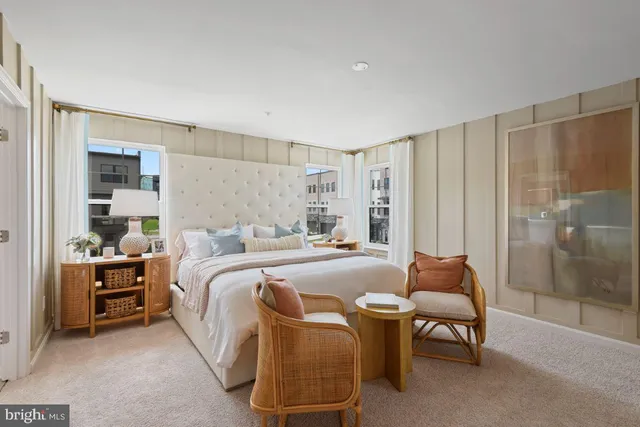 a bed room with a bed and a chair