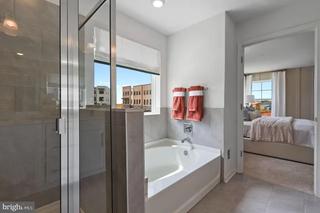 a bathroom with a tub and shower
