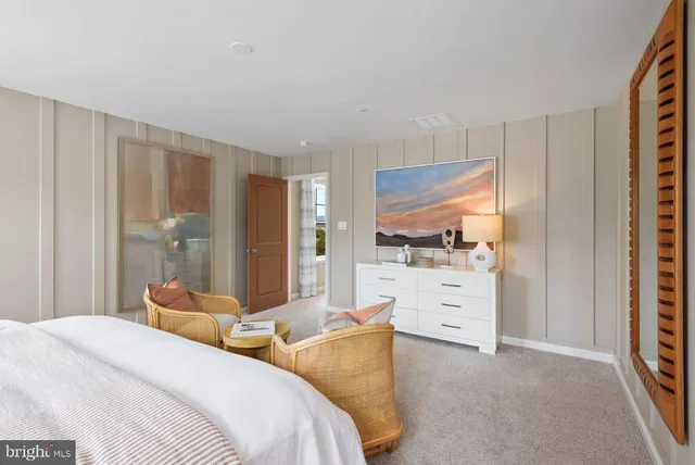 a bedroom with a bed and dresser