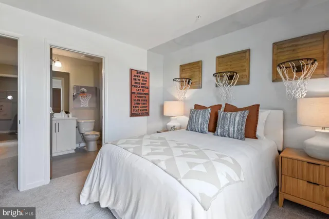 a spacious bedroom with a bed and a couch