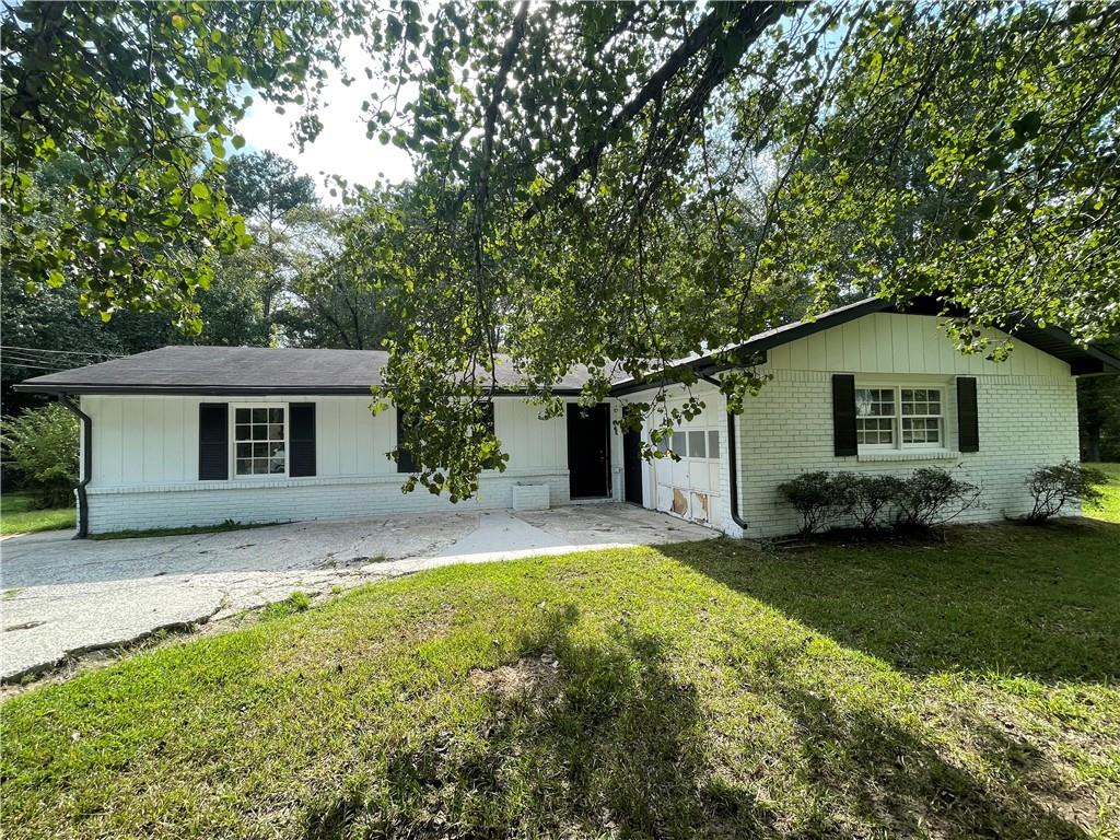 6565 Cedar Hurst Trail Atlanta, GA 30349 - Photo 1 of 1 a house that has a backyard