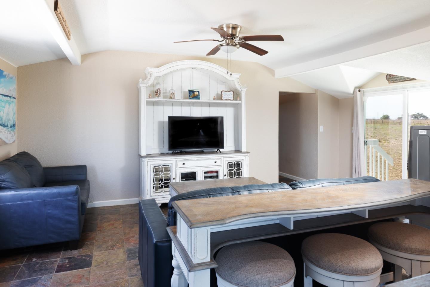 13265 Avila Road Castroville, CA 95012 - Photo 16 of 31 a living room with granite countertop furniture and a fireplace