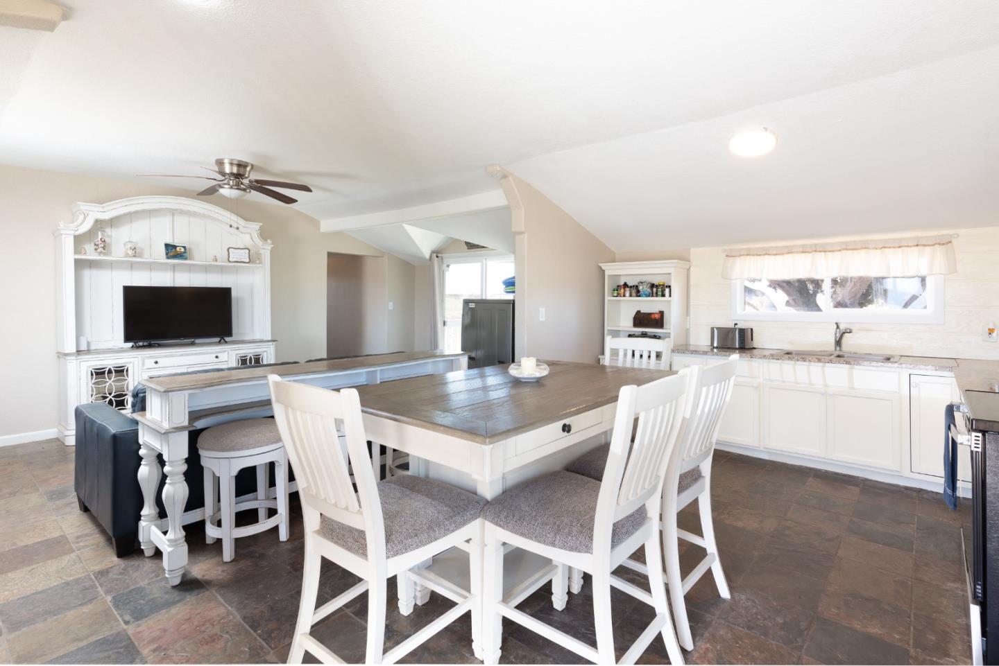 13265 Avila Road Castroville, CA 95012 - Photo 20 of 31 a view of a dining room with furniture and a kitchen