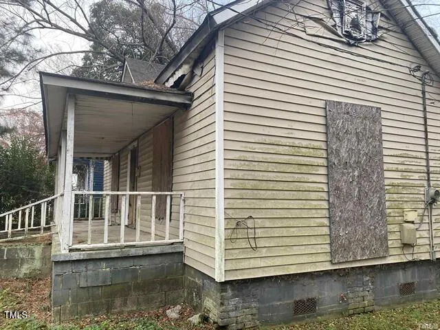 a view of a white house with a window