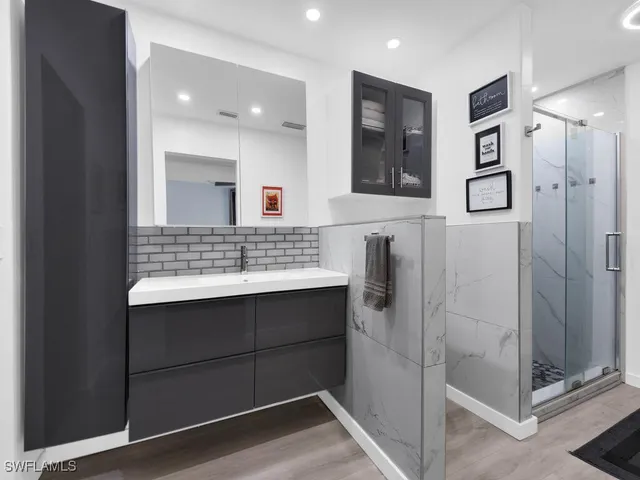 a bathroom with a sink and a mirror