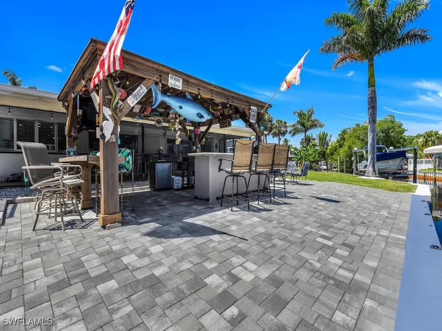 a view of a chairs and table in a patio