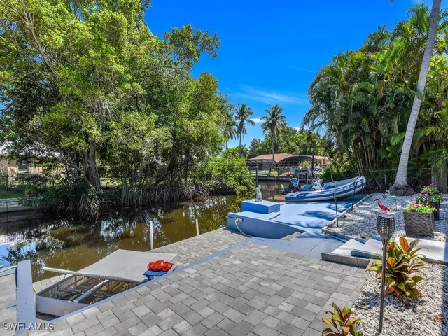 a view of a backyard with sitting area