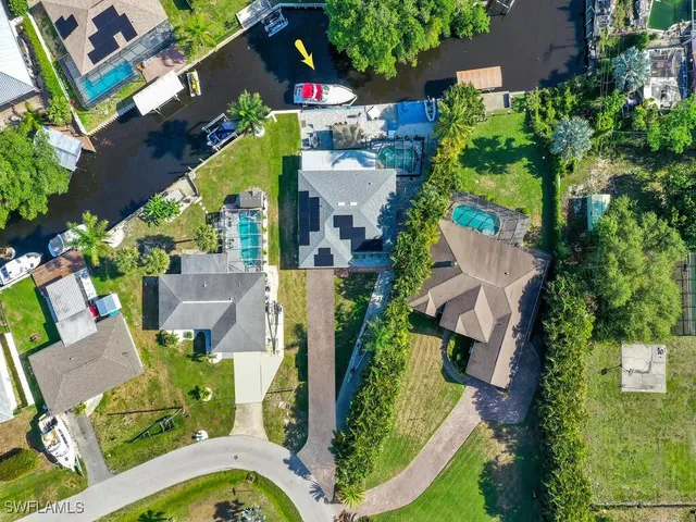an aerial view of houses with outdoor space