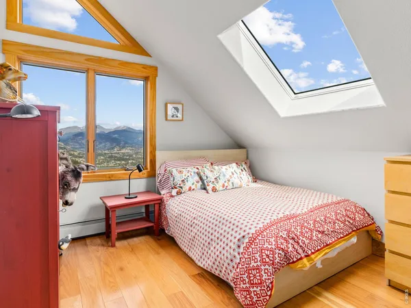 a bedroom with a bed and glass window