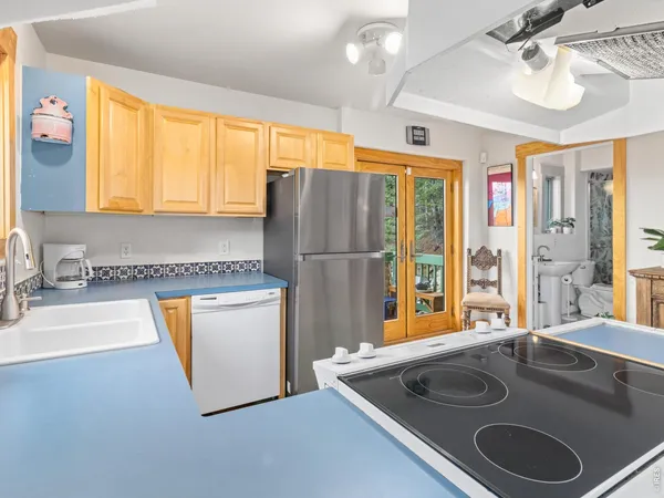 a kitchen with a sink and a large window