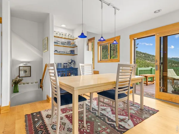 a kitchen with stainless steel appliances kitchen island granite countertop a refrigerator a stove and a sink with dishwasher