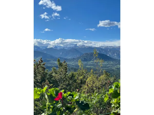 a balcony with furniture and city view
