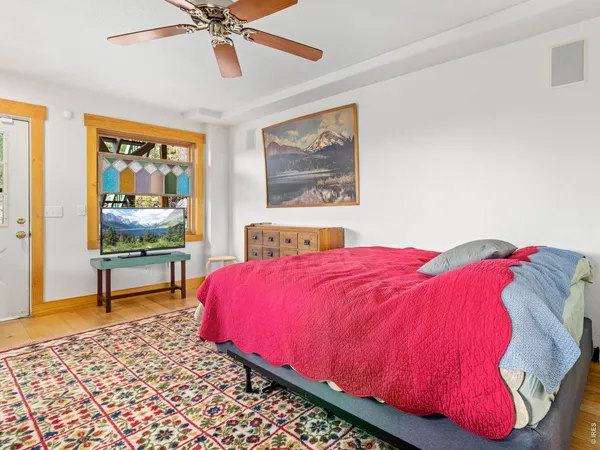 a view of an empty room and mountains