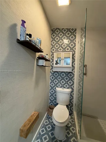 a bathroom with a toilet and a sink