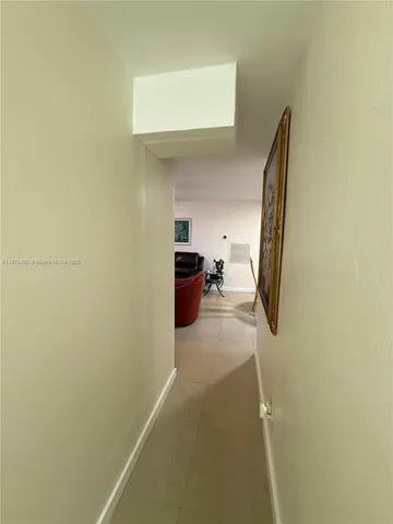 a view of a hallway with storage