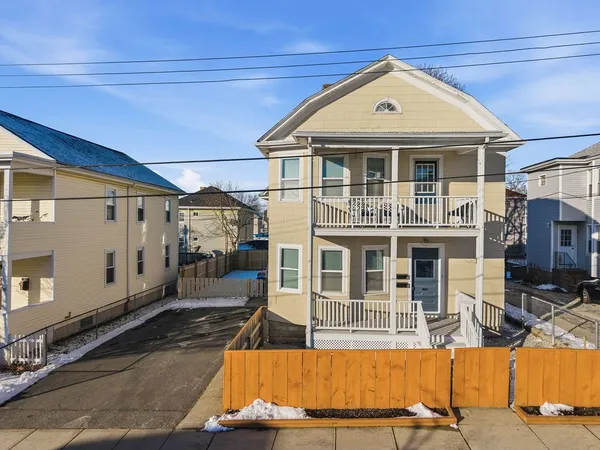 a view of a house with wooden floor and a yard