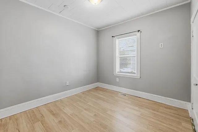 a bathroom with a shower and a sink