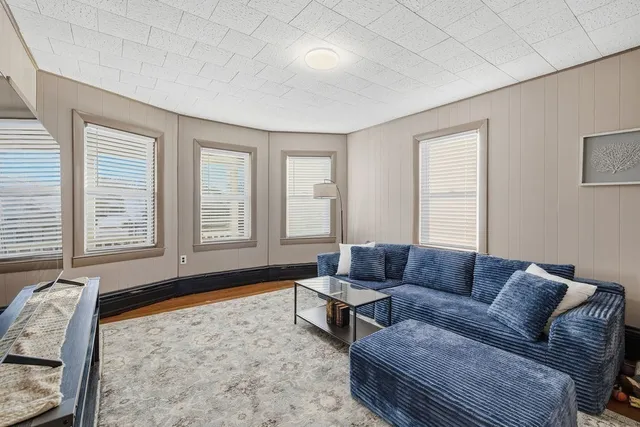 a living room with furniture and a rug