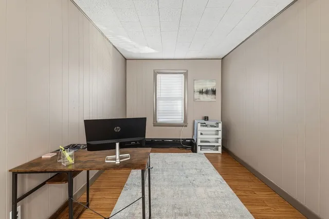 a view of a livingroom with furniture and window