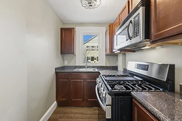 a view of a livingroom with wooden floor
