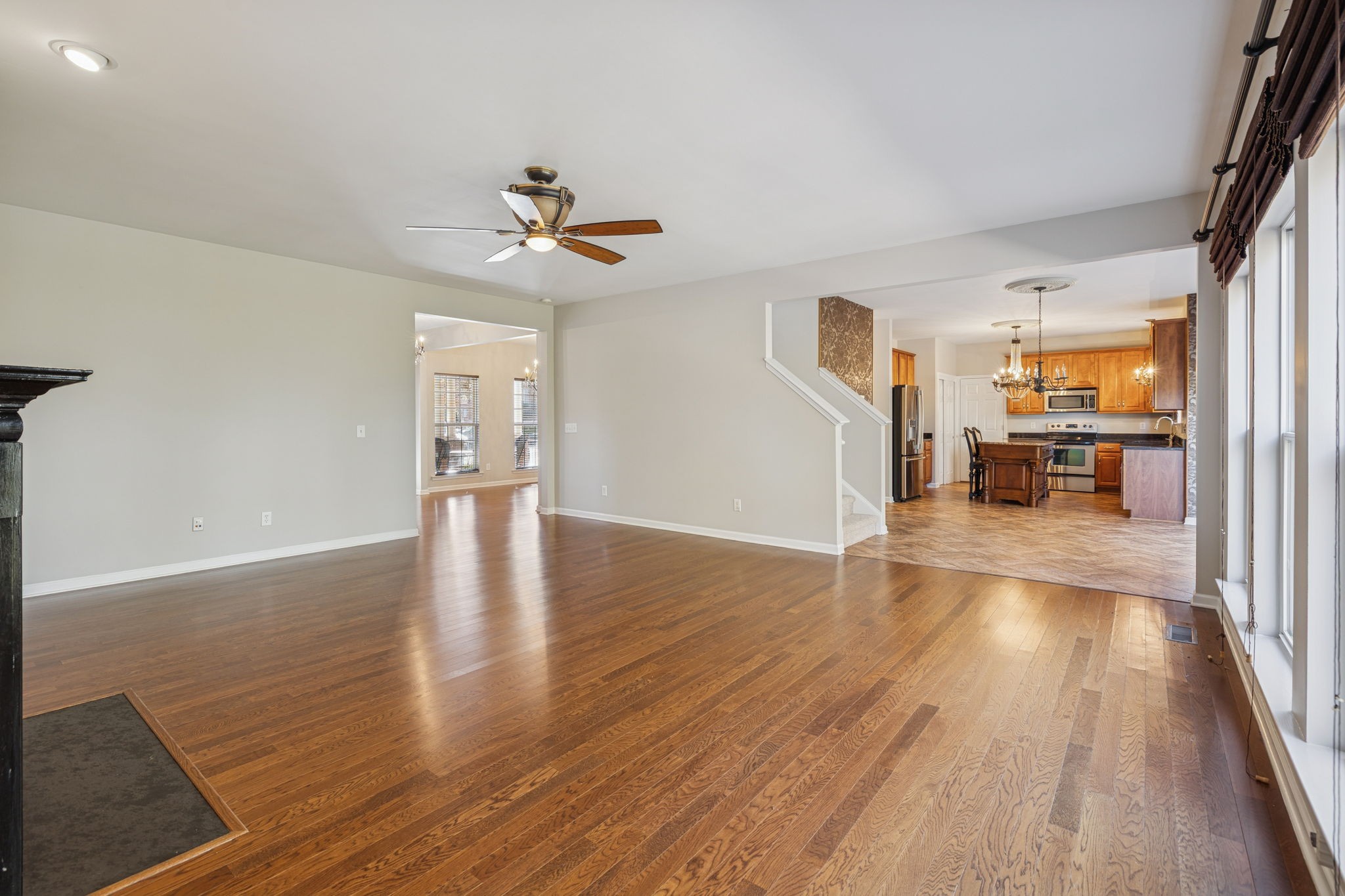 322 Forest Bend Drive Mount Juliet, TN 37122 - Photo 13 of 62 a view of a livingroom with furniture a ceiling fan and wooden floor
