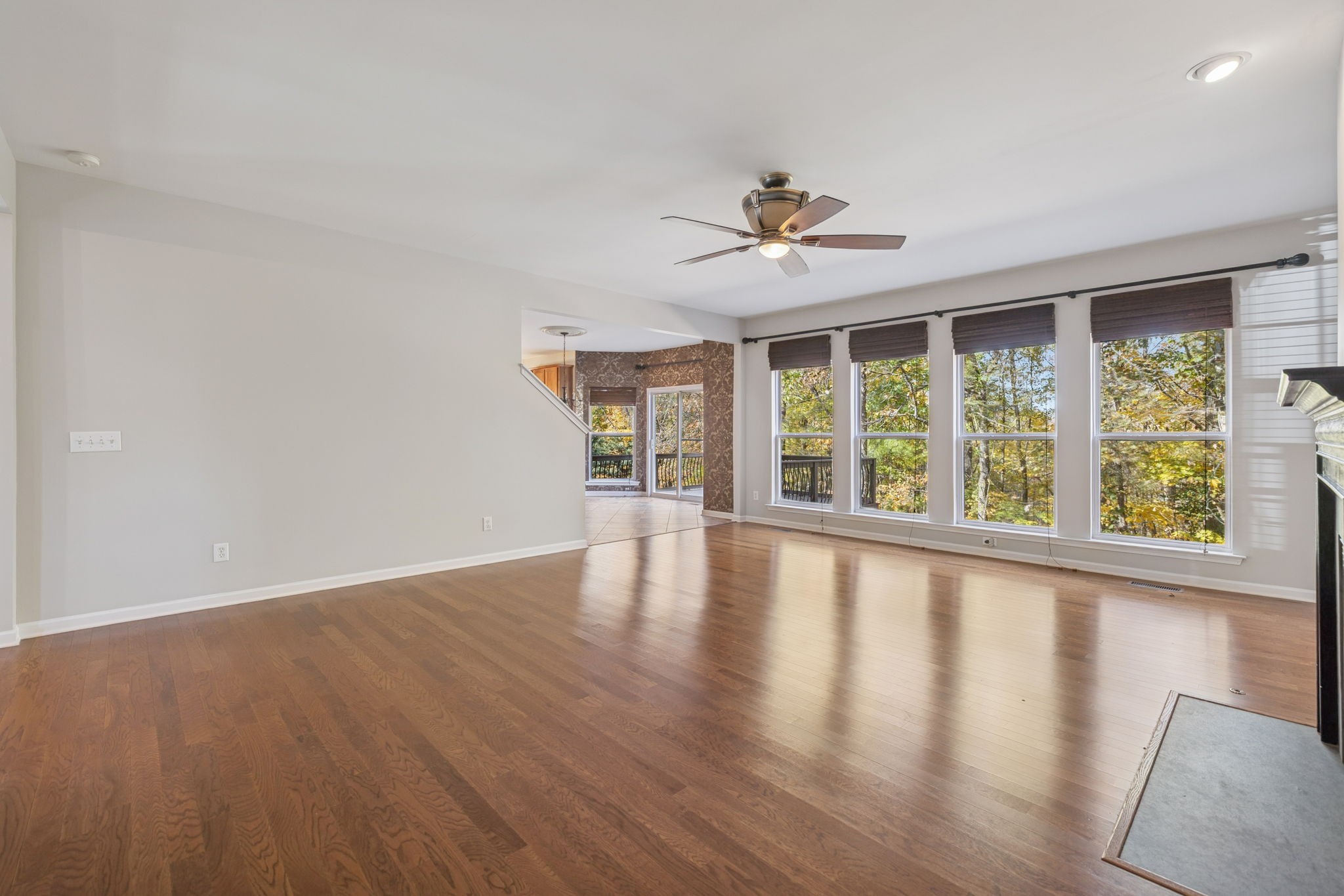 322 Forest Bend Drive Mount Juliet, TN 37122 - Photo 14 of 62 a view of an empty room with wooden floor and a window