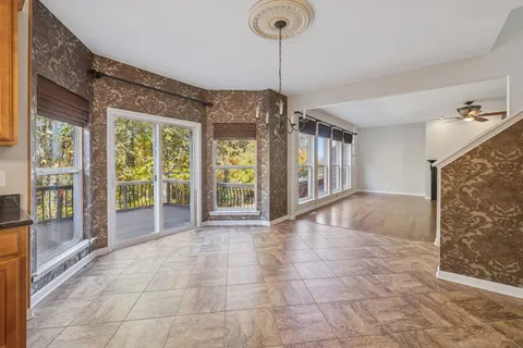 a kitchen with kitchen island granite countertop a stove oven and a sink