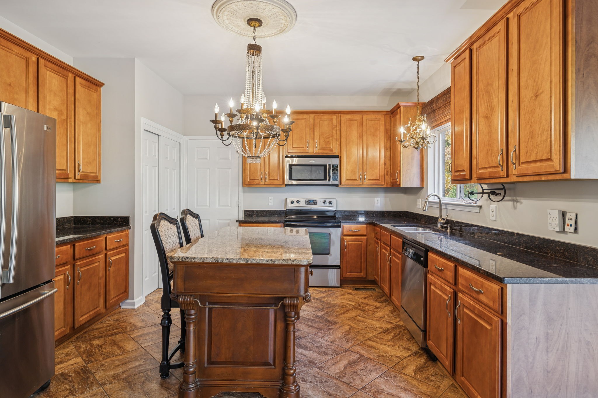 322 Forest Bend Drive Mount Juliet, TN 37122 - Photo 20 of 62 a kitchen with granite countertop a sink appliances cabinets and furniture