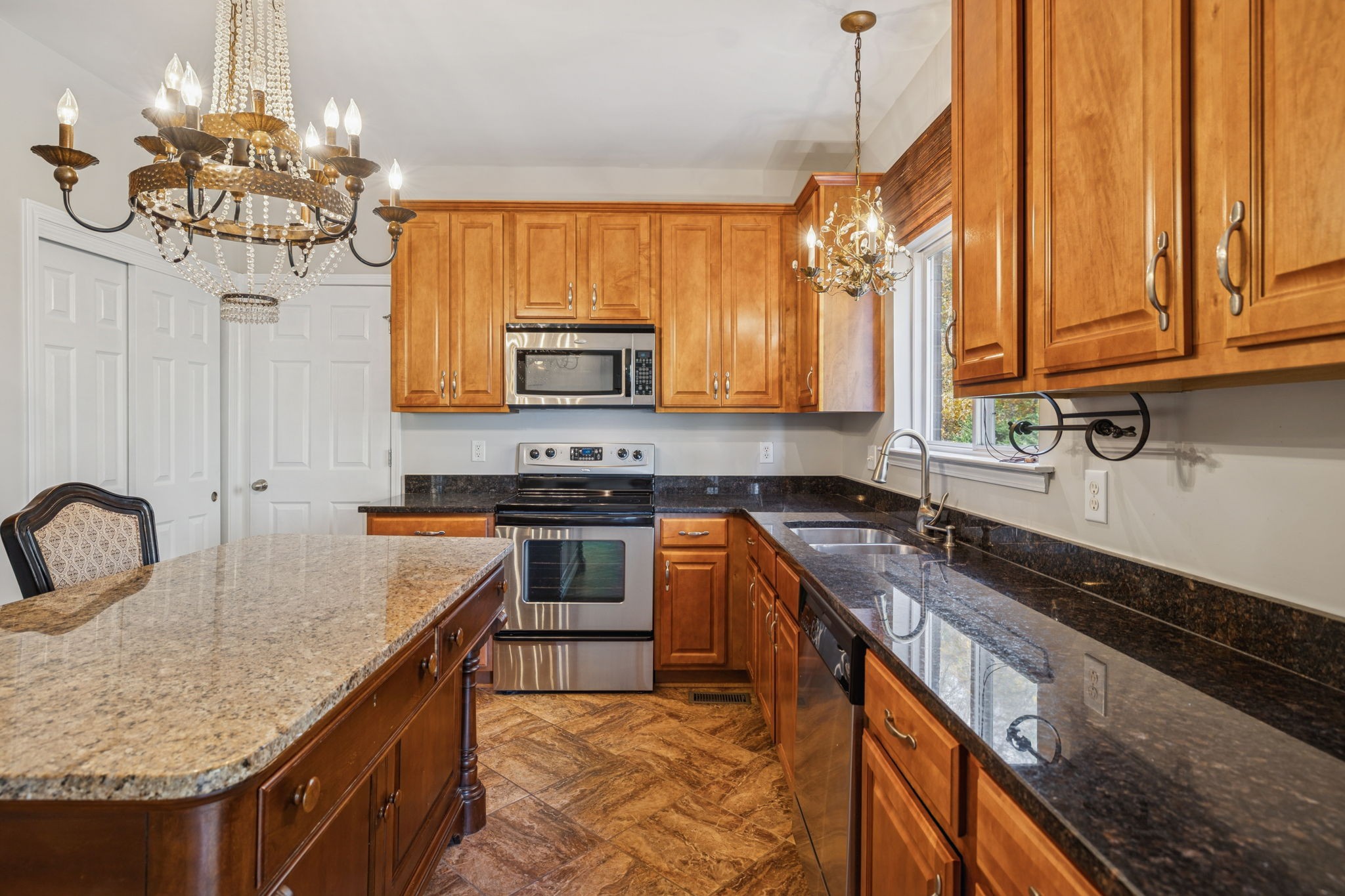 322 Forest Bend Drive Mount Juliet, TN 37122 - Photo 21 of 62 a kitchen with stainless steel appliances granite countertop a sink a stove and a wooden cabinets