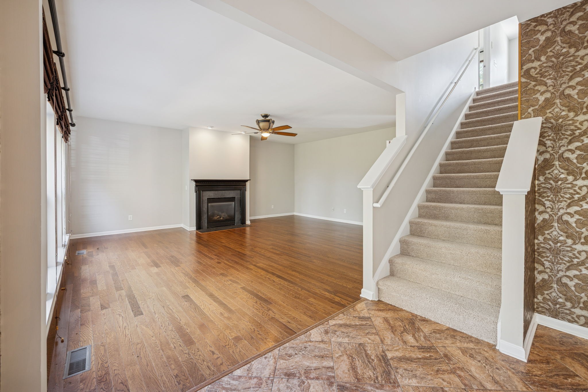 322 Forest Bend Drive Mount Juliet, TN 37122 - Photo 26 of 62 a view of a livingroom with wooden floor and staircase