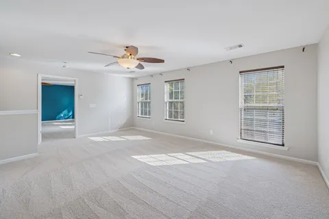a bathroom with a bathtub and window