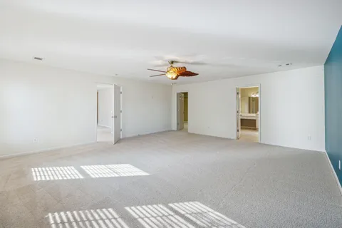 a view of a livingroom with a window and furniture