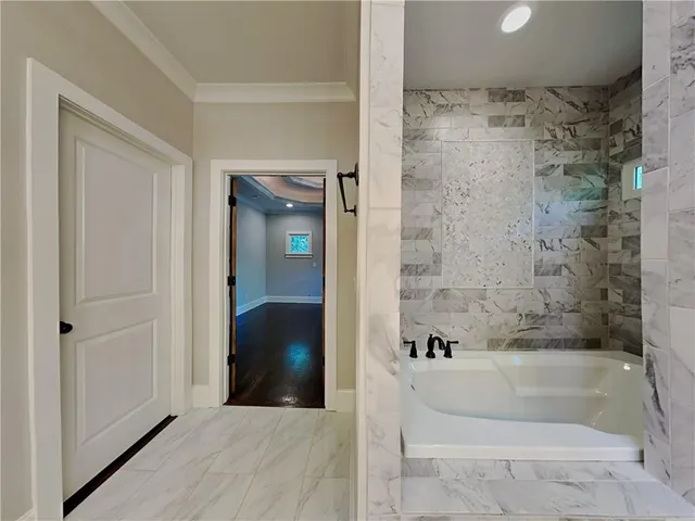 a bathroom with a bathtub and a shower