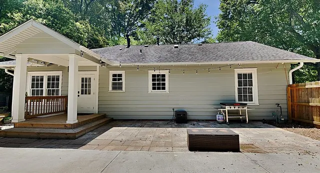 a front view of a house with outdoor seating