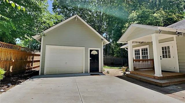 a front view of a house with garage