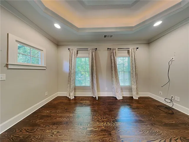 a view of room with hardwood floor and window