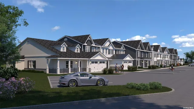 a front view of a house with a garden and yard