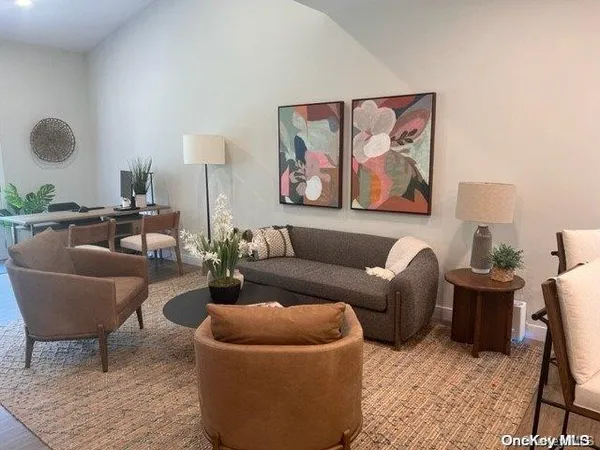 a living room with furniture and a rug