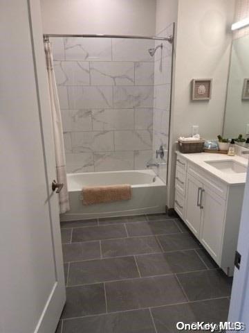 201 Jerusalem Hollow Road Manorville, NY 11949 - Photo 9 of 15 a bathroom with a bathtub a sink and a shower