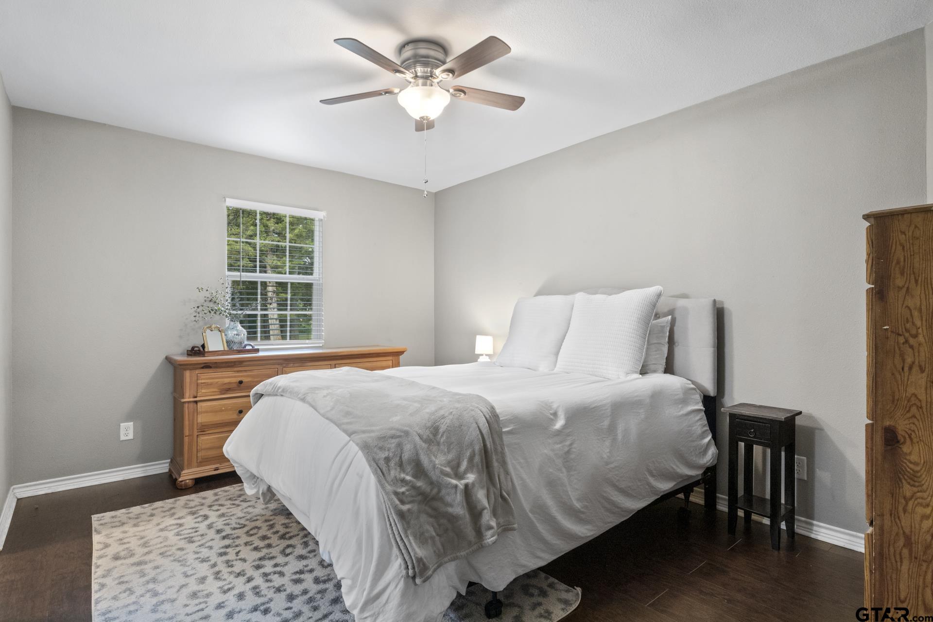 655 Daingerfield Street Pittsburg, TX 75686 - Photo 13 of 27 a bedroom with a bed and a window